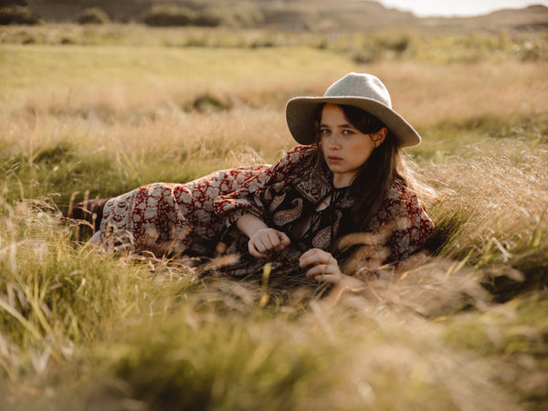 The Lara Dress, Alone shot of dress in field The Lara Dress Original and vintage block printed in India, Natural Dyes on 100% cotton